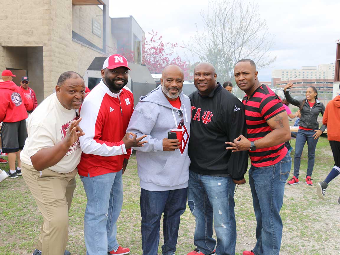 Kappa Alpha Psi Eta Chapter members at the UNL Red and White Spring Game tailgate at the Malone Center