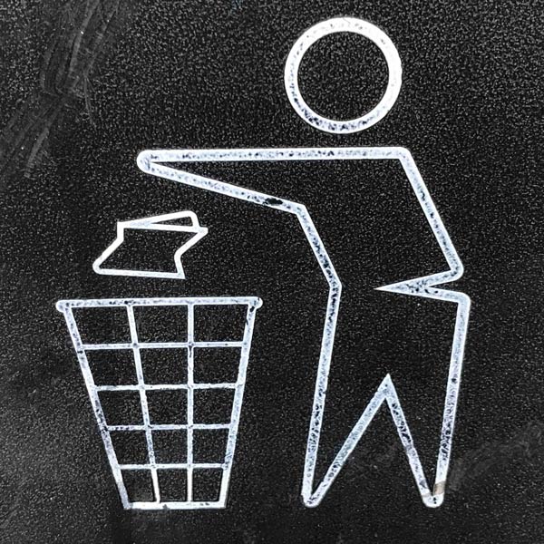 person icon throwing away in trash container