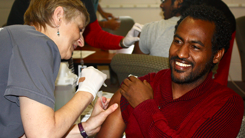 An international student receives a flu shot from the University Health Center at the University of Nebraska-Lincoln