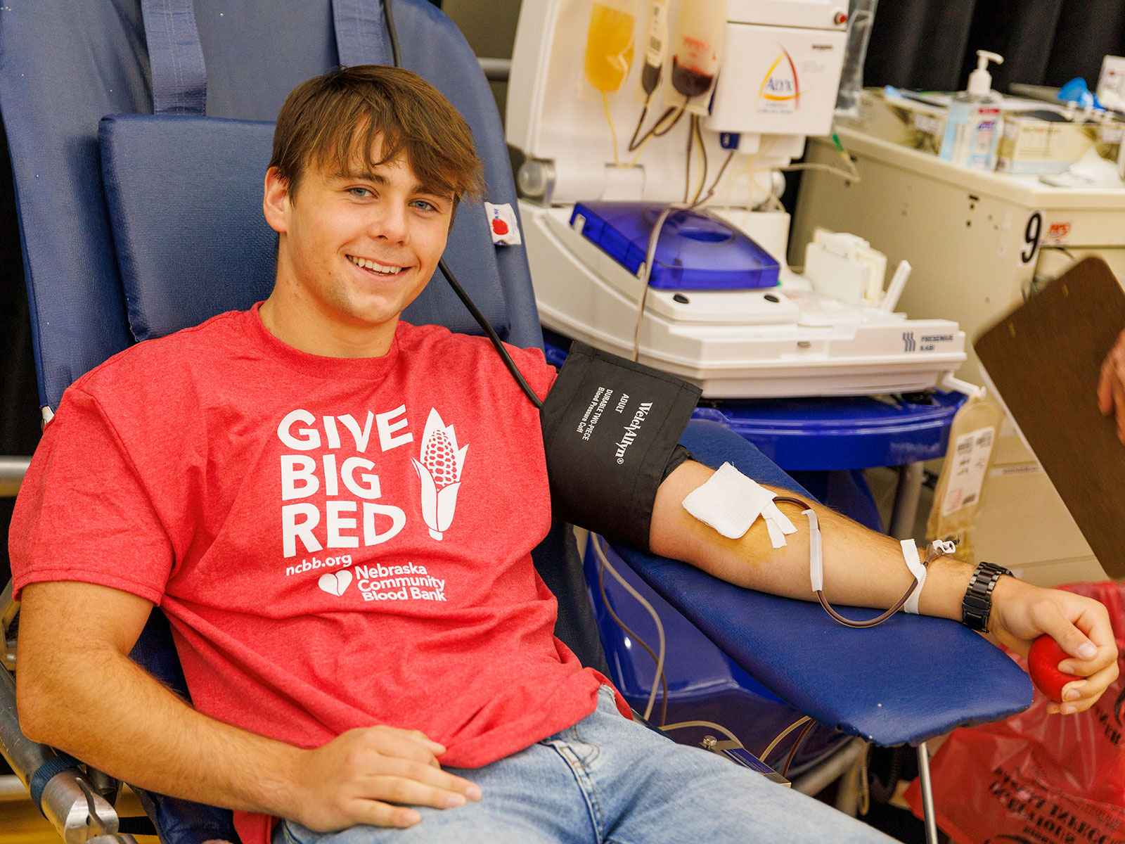 A student gives blood during a campus blood drive