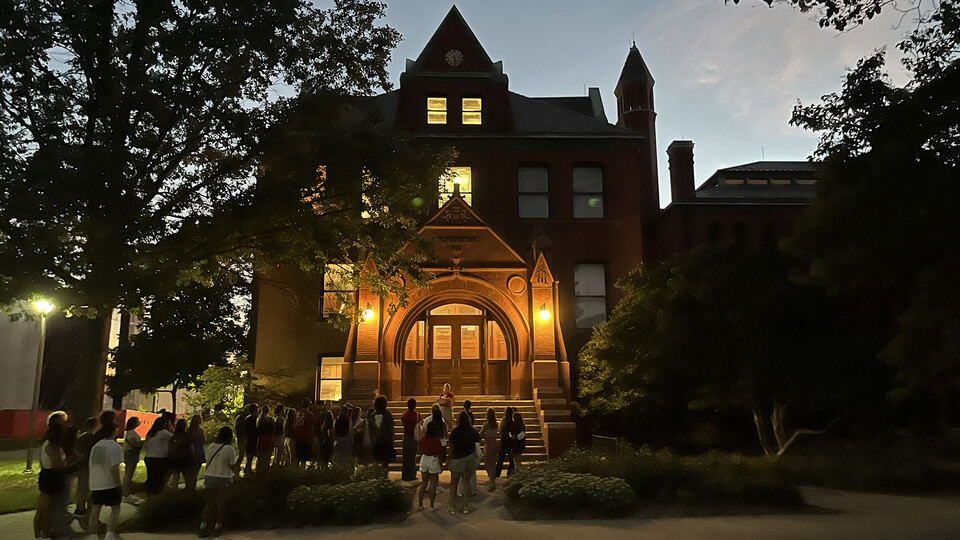 A group of students gathers at Architecture Hall to learn some of the history of the oldest building on campus. [Deann Gayman | University Communication and Marketing]