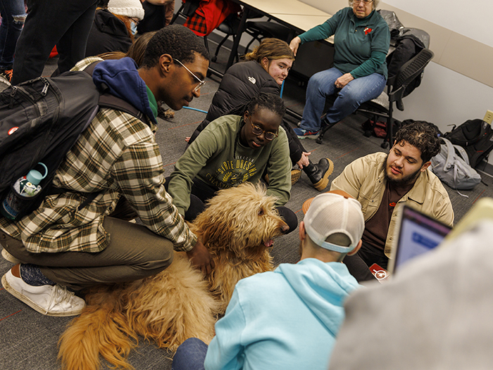 University of Nebraska–Lincoln students enjoy time with certified therapy dogs at the BIG REG PAWP UP activity in Love Library South. February 9, 2023. [Mike Jackson | Student Affairs]