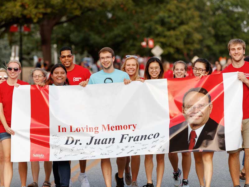 Student members of the Character Council march in the homecoming parade at the University of Nebraska-Lincoln to honor Dr. Juan N. Franco.