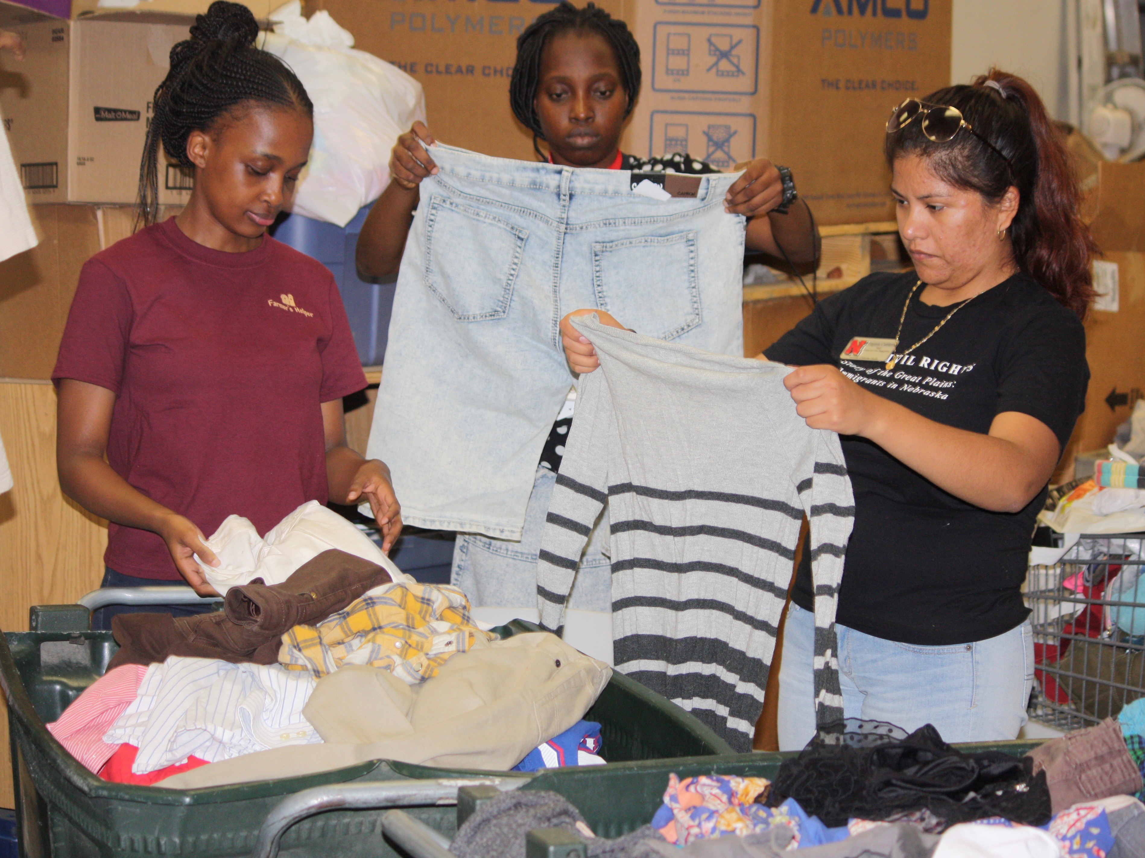 Participants in the Mandela Fellows program sort donations to the Homeless Prevention Center.