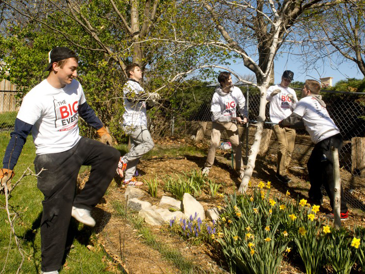 Members of Sigma Alpha Epsilon fraternity at the University of Nebraska–Lincoln clear trees and yard waste at a Lincoln residence during a previous year's The Big Event. The upcoming day of service is set for April 23, 2022. [University of Nebraska–Lincoln] 