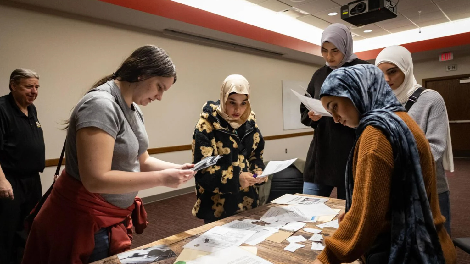 A group of students attempt to solve the escape room together during Campus Nightlife’s Mystery and Crime Escape Rooms and Video Games event at the East Campus Union on Friday, March 3, 2023, in Lincoln, Nebraska. [photo by Sophia Walsh | Daily Nebraskan]