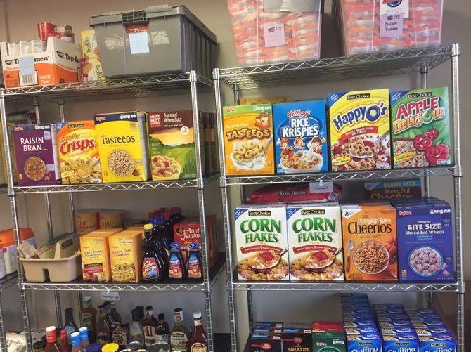 Shelves of packaged foods inside the Husker Pantry.