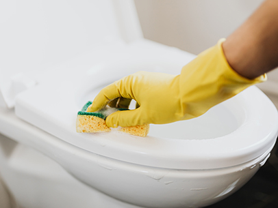 Disinfecting toilets, faucets, and handles after each use can help slow the spread of viruses between people living together.