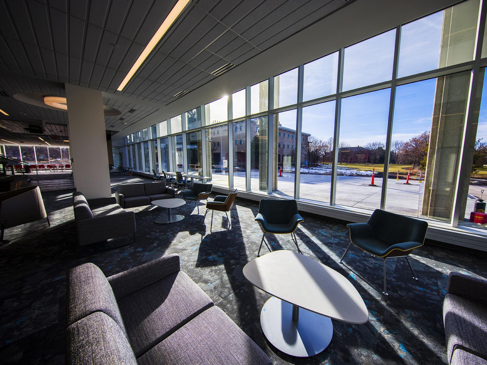 Inside the Dinsdale Learning Commons, facing the wall of windows with a view to the west.