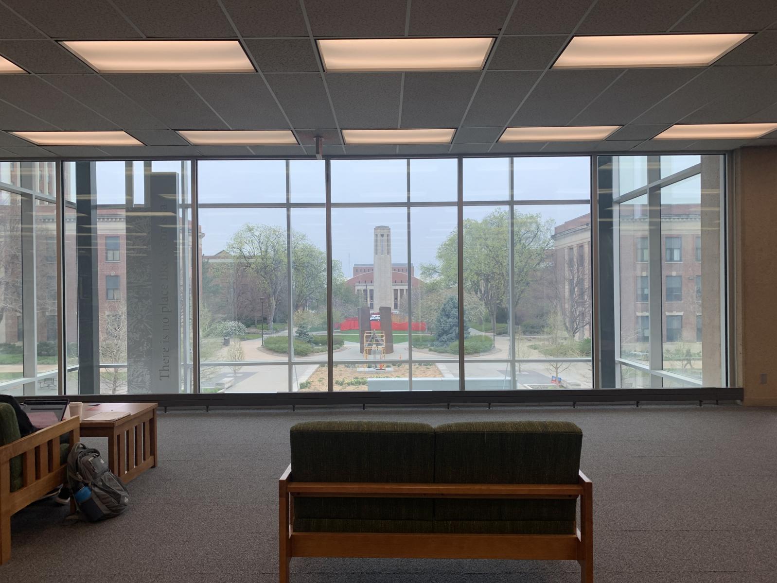 Picture window on the 2nd floor of Love Library with a view of Mueller Tower.
