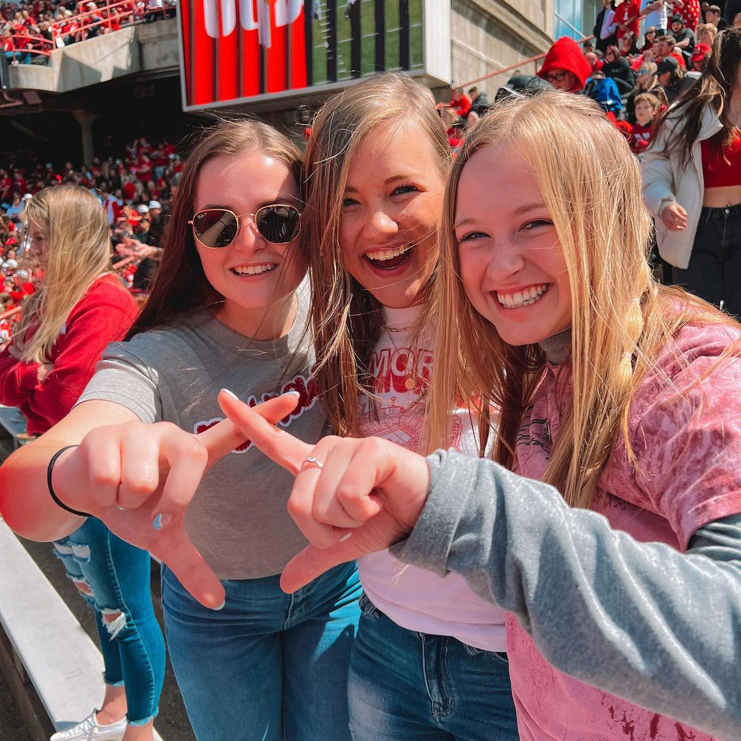 Three friends at Husker Spring Game