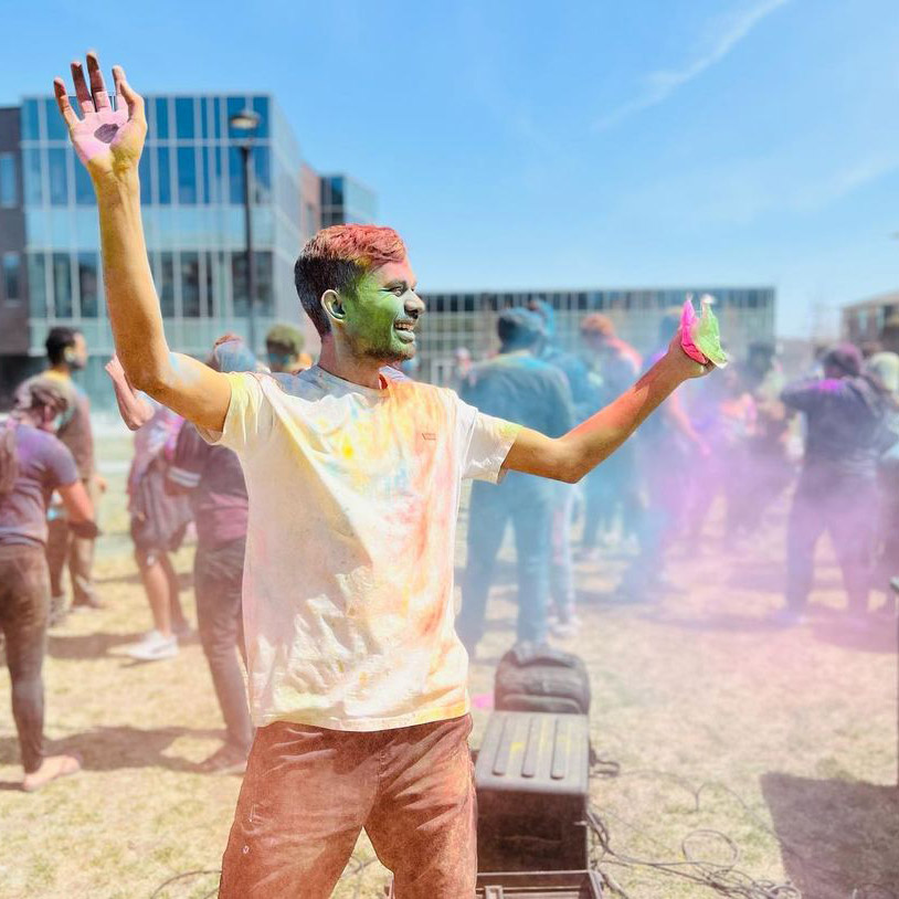 Student covered in holi colors at UNL
