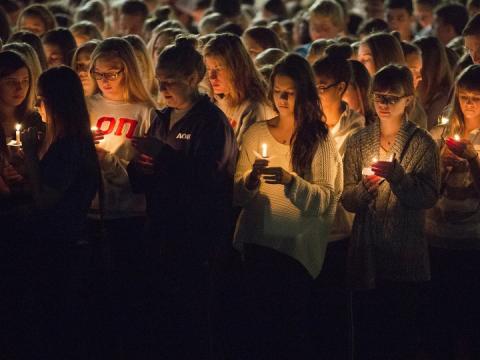 Students participate in a candlelight vigil honoring Keaton Klein and Clayton Real in 2014. The university will honor students, faculty, staff and alumni who died during the current academic year on April 20.