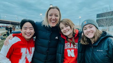 Carly Gartner (right) and friends take a photo with former Husker Volleyball player and Olympian Jordan Larsen. (courtesy image)