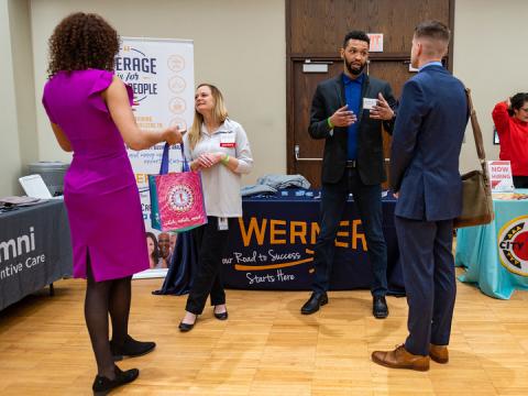 Huskers meet with representatives from Werner Enterprises during the first day of the spring Career Fair. The fair concludes. Feb. 12.