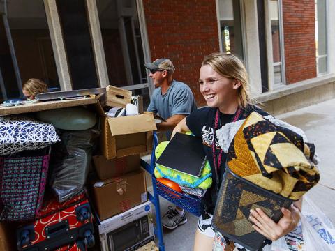 Makenzie Johnson moves into her room with the help of her parents, Ryan and Jennifer, in August 2018. This year, students will move in the week of Aug. 19.