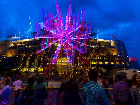 The east side of Memorial Stadium is illuminated by the Ferris wheel during the 2021 Cornstock Festival. 