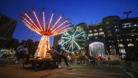 The Musical Chairs ride and Ferris wheel light up the East Stadium Plaza during the 2022 Cornstock Festival. The 2023 festival is 4 to 8 p.m. Oct. 27, again on the plaza. The event is free and open to the public. [Craig Chandler | University Communication and Marketing]