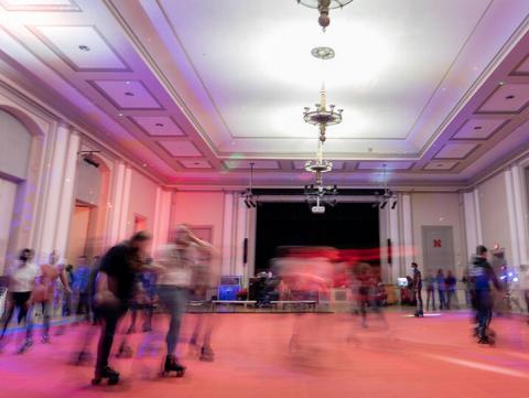 Students roll around the Nebraska Union Ballroom during the Club 80 roller skating event in the Nebraska Union Ballroom on Feb. 19. The event was hosted by Student Involvement. (photo by Jordan Op | for University Communications)