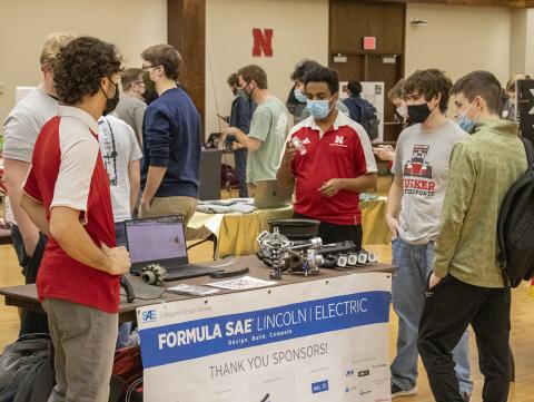 Members of the student organization Husker Motorsports UNL Formula SAE talk with other students at the Spring Club Fair, Feb. 1, 2022 at the University of Nebraska-Lincoln [Mike Jackson | Student Affairs] 