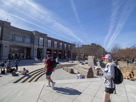 University of Nebraska-Lincoln students gather on the Nebraska Union Memorial Plaza to enjoy the clear sky and warm weather. March 2, 2022. [Mike Jackson | Student Affairs]