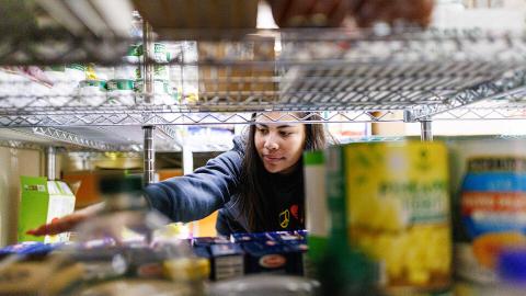 Bree Bell, a freshman from Omaha, sorts food in the storage room at Matt Talbot in January during the month's Engage Lincoln event, which coincided with MLK Week. Engage Lincoln events happen the third week of each month. [Craig Chandler | University Communication and Marketing]