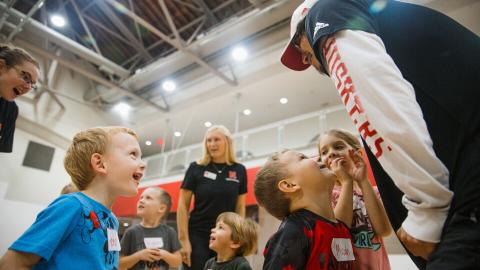 Itty Bitty sports staff interact with participants