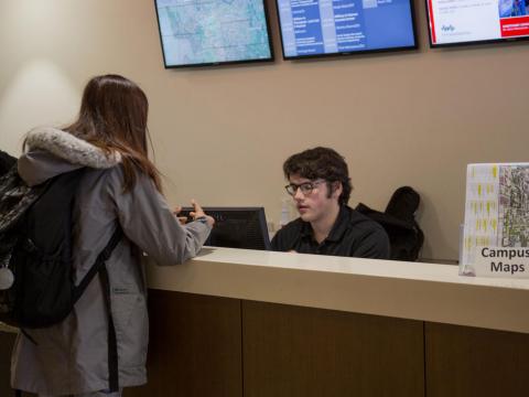 A worker at the welcome desk in the Nebraska Union at the University of Nebraska-Lincoln answers a student's question on Wednesday, Jan. 9, 2019, in Lincoln, Nebraska. | Daily Nebraskan