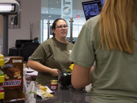 C-Store employee Becky Rowley scans food items for a UNL student at the Cather C-Store on Thursday, Sept.12, 2019, in Lincoln, Nebraska.