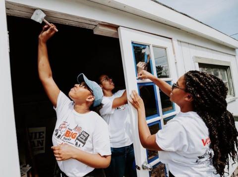 University of Nebraska-Lincoln students volunteer to help paint a home during The Big Event in 2019.