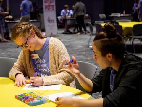 Participants color at the International Women's Day celebration in the Red Cloud Room at Willa Cather Dining Center on Wednesday, March 4, 2020, in Lincoln, Nebraska.