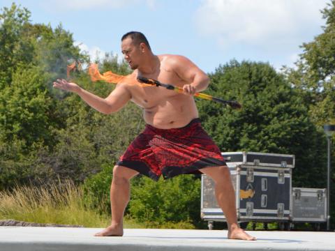Polynesian torch dancer at University of Nebraska-Lincoln OASIS Kickoff event on Aug. 27, 2017.