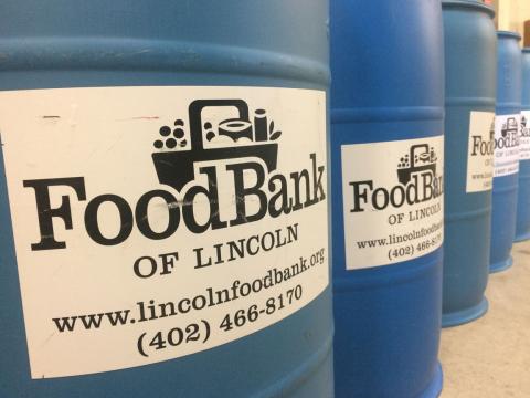Students load donation barrels to give back to the Lincoln community