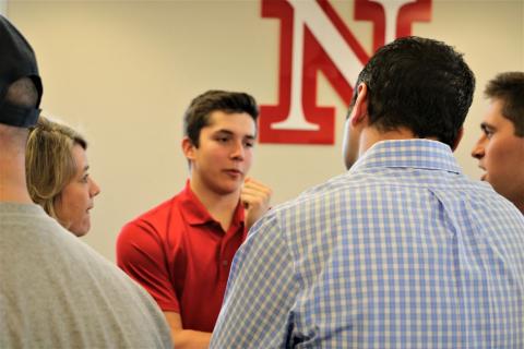 A Nebraska fraternity member answers questions for potential members and their parents at Greek Preview.
