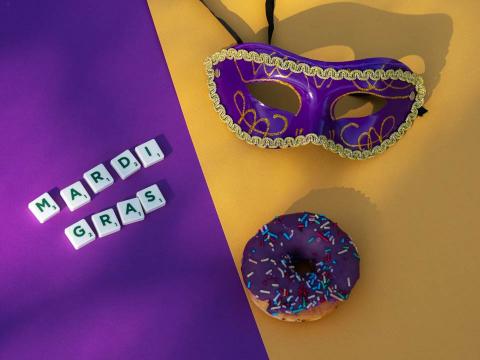 Mardi gras mask, food and letters