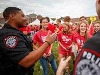 Officers from Nebraska's University Police Department interact with students at a back-to-school event last August.
