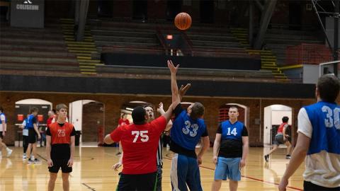 Two players fight for the tip-off to start the game with UNL Unified at the UNL Recreation Center on Wednesday, March 29, 2023, in Lincoln, Nebraska.  [photo by Evan Dondlinger | Daily Nebraskan]