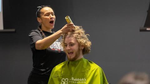 A contestant gets his head shaved during the Shave for the Brave event at the Willa Cather Dining Center on Thursday, March 30, 2023, in Lincoln, Nebraska.  [photo by Kaidence Donahue | Daily Nebraskan]
