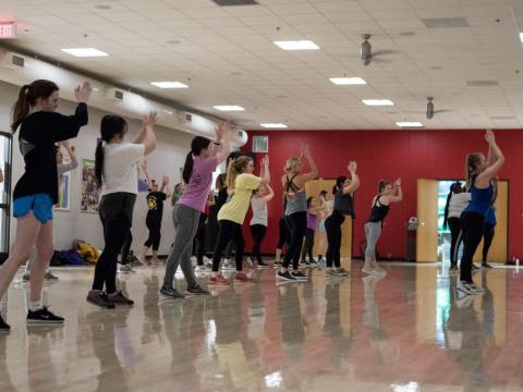 Students participate in a cardio dance class at the Campus Recreation Center on Jan. 9, 2018.