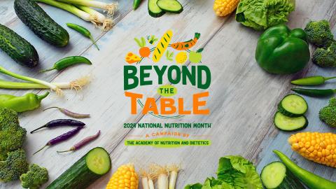 National Nutrition Month 2024 logo on a table with vegetables around it