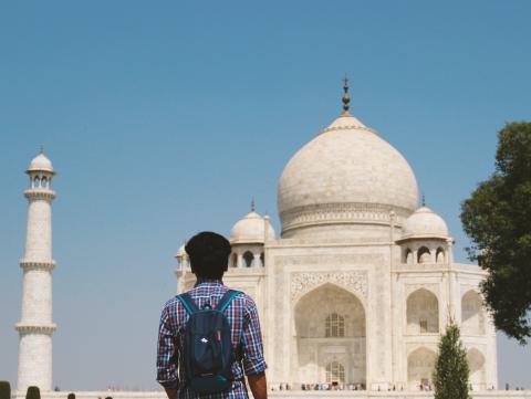 A man looks at the Taj Mahal in Agra, India. (Photo by Arash Bal on Unsplash)